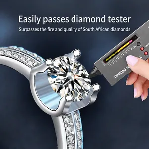 Moissanite 925 sterling silver ring tested with a diamond selector on a blue background