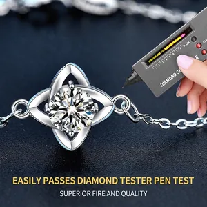 Moissanite clover bracelet in S925 sterling silver being tested by a diamond tester pen