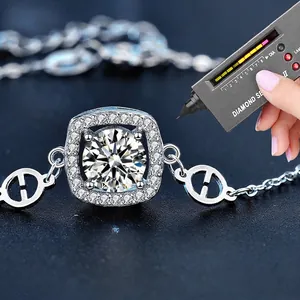 925 silver halo bracelet with round moissanite on a dark blue textured background