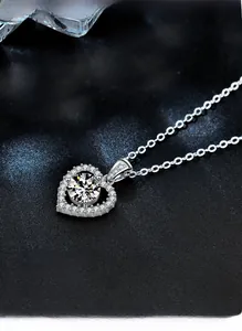 Macro view of double heart S925 silver pendant necklace with sparkling moissanite stones