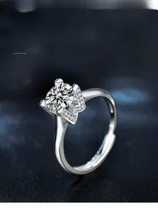 Detail of 925 sterling silver ring with crown setting and brilliant moissanite stone