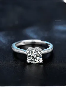 Detailed close-up of 925 silver ring featuring a round moissanite in four-prong setting