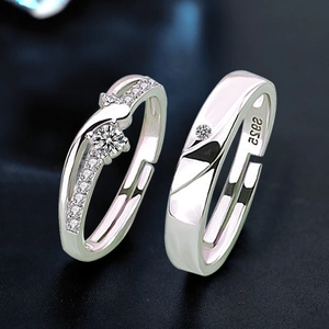 Macro view of S925 sterling silver Mobius couple rings with sparkling cubic zirconia