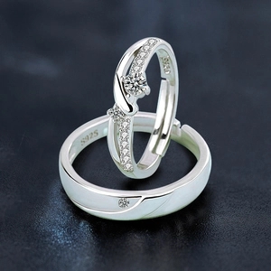 Macro detail of S925 sterling silver Mobius rings with sparkling zircon inlay and hallmark