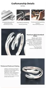 Detail showing the S925 sterling silver stamp and polished texture of the hugging hands ring