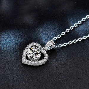 925 silver heart necklace with moissanite pendant on elegant blue background