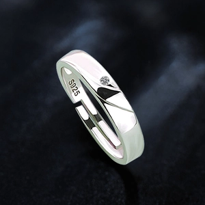 Macro shot of S925 sterling silver Mobius ring showing adjustable band and zircon stone