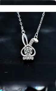 Macro shot of 925 silver rabbit pendant showing 3EX hearts and arrows moissanite cut