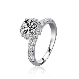Elegant 925 sterling silver crown ring with round moissanite and pave setting on white background