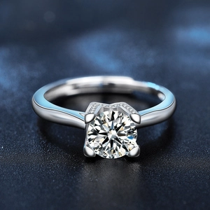 Classic 925 sterling silver four-prong solitaire ring with a brilliant round moissanite