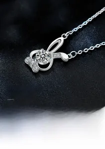Macro shot of S925 sterling silver rabbit pendant with large round-cut moissanite