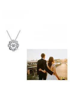 Macro view of sterling silver starburst pendant with moissanite center stone detail