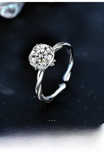 Macro detail of cushion cut moissanite set in a twisted S925 sterling silver band