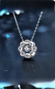 Macro detail of 925 sterling silver starburst pendant with brilliant cut moissanite stones