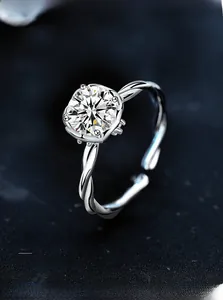 Macro detail of 3EX cut moissanite ring with twisted silver band and 58 facets