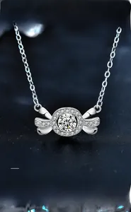 Close-up of 925 silver candy pendant with 3EX round cut moissanite and micro-pave stones