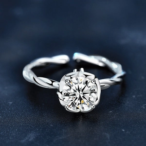 Adjustable 925 silver twist ring featuring a brilliant round cut moissanite center stone