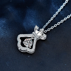 925 silver crown necklace with dancing moissanite pendant on elegant blue background
