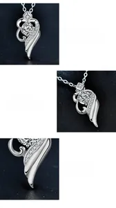 Vue détaillée du pendentif ailes d'ange en moissanite avec serti à quatre griffes en argent
