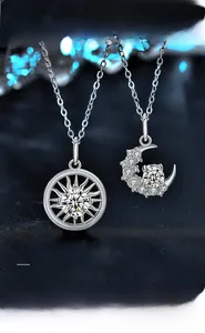 Macro shot showing 3EX cut moissanite and eight hearts and arrows on sun moon necklace