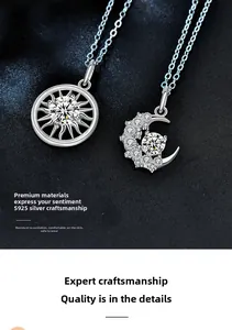Macro shot of S925 sterling silver sun and moon pendants with cubic zirconia inlay
