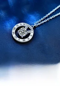 Macro shot of S925 silver pendant with Roman numerals and pavé diamonds surrounding a main stone