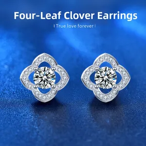 Macro view of silver clover earrings with moissanite center and micro-pave petals