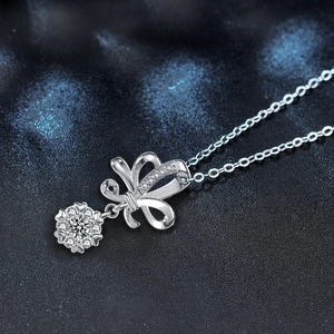 Collier en argent 925 avec pendentif nœud et fleur étincelante serti de zircons clairs