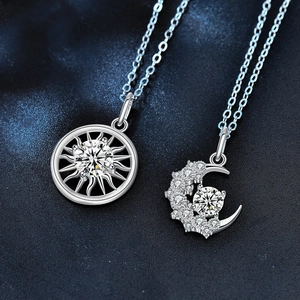 925 silver sun and moon couple necklaces with moissanite pendants on blue background