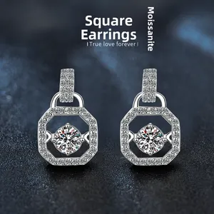 Macro detail of square moissanite earrings in S925 silver with a brilliant center stone