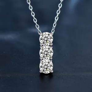 Detailed macro view of 925 silver necklace with three vertical moissanite stones