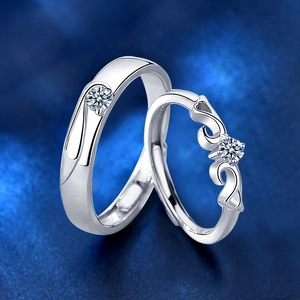 Detailed view of adjustable silver couple rings with brilliant round cut diamonds