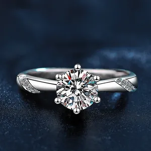 Macro shot of 925 sterling silver ring with six-prong moissanite and twisted pavé band