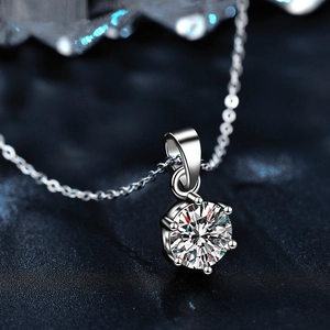 Macro shot of 925 sterling silver six-prong setting necklace with brilliant moissanite stone