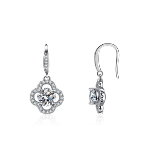 925 silver four-leaf clover drop earrings with moissanite pave setting on white background