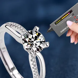 Adjustable 925 sterling silver moissanite ring being tested with a diamond selector