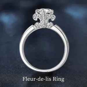 Elegant 925 sterling silver fleur-de-lis ring with sparkling diamonds on blue background
