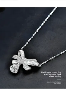 Macro detail of 925 silver bow pendant with pear-cut stone and nano-plating finish