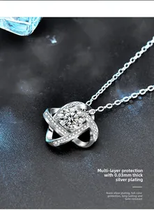 Close-up of 925 silver clover pendant with moissanite and thick nano-plated finish