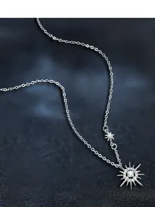 Detail showing S925 sterling silver sunburst pendant with sparkling moissanite stones