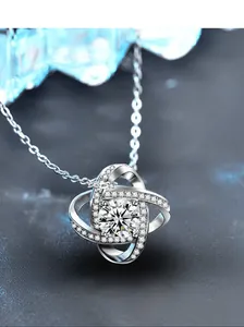 Macro shot of S925 sterling silver four-leaf clover pendant with sparkling center stone