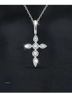 Macro view of cross pendant featuring high-grade moissanite with 3EX cut in silver finish