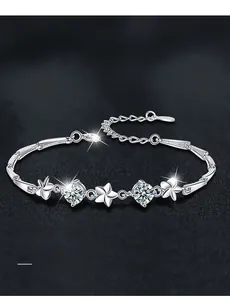 Macro shot of S925 sterling silver clover bracelet with brilliant cut moissanite stones