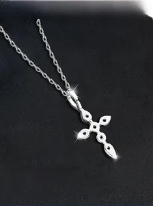 Macro shot of S925 sterling silver cross necklace featuring black gemstones and refined chain