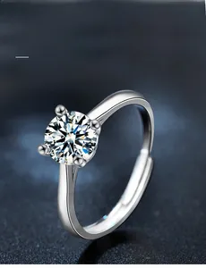 Macro shot of 3EX cut moissanite ring with 58 facets and adjustable silver band