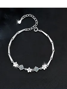 Macro view of S925 sterling silver four-leaf clover bracelet with zircon gemstones