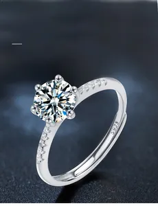 Detail of S925 sterling silver stamp and 58 facets moissanite on a classic six-prong ring