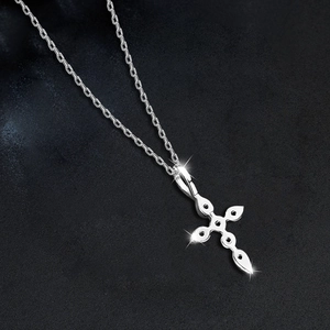 Polished S925 sterling silver cross pendant necklace with star-point details on black background