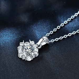 Elegant 925 sterling silver snowflake pendant necklace with moissanite on dark background