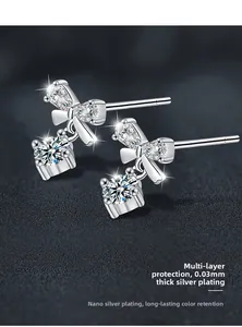 Detail view of S925 silver bow earrings with round moissanite and nano-plating finish